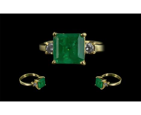 Ladies 18ct Gold Emerald &amp; Diamond Set Ring - The Shank Marked 18ct. The Square Stepped Cut Emerald of Excellent Colour. 