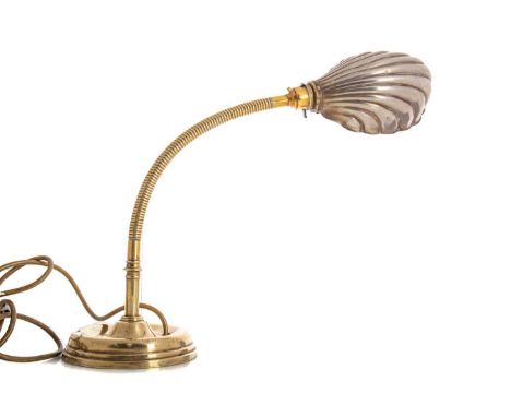 ART DECO BRASS 'SHELL' DESK LAMP EARLY 20TH CENTURY with silvered shade, adjustable column, over a weighted stepped circular 