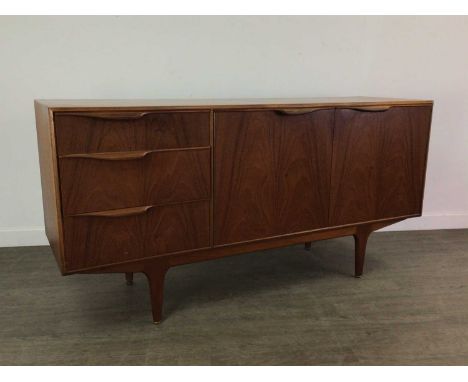 TOM ROBERTSON FOR MCINTOSH OF KIRKCALDY, 'MOY' TEAK SIDEBOARD 1960-69 with three short drawers and twin cupboard doors, raise