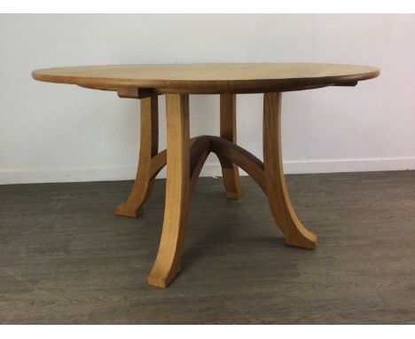 PETER HALL &amp; SON OF STAVELEY, CIRCULAR OAK DINING TABLE WITH SIX CHAIRS LATE 20TH CENTURY the table with arched stretcher