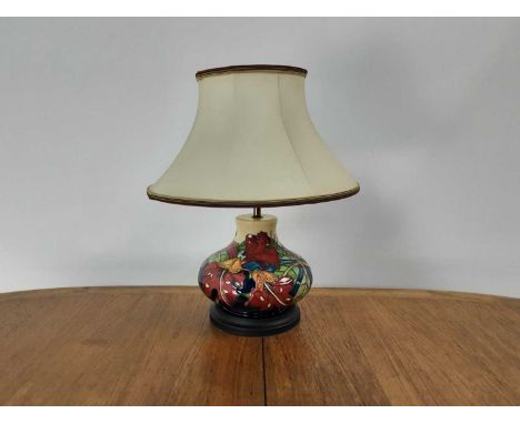 PHILIP GIBSON FOR MOORCROFT, 'SIMEON' PATTERN TABLE LAMP CONTEMPORARY of ovoid form, tube lined with foliage on a cream groun