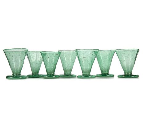 JAMES COUPER &amp; SONS OF GLASGOW (1850-1922), SET OF SEVEN CLUTHA GLASS LIQUEUR GLASSES LATE 19TH CENTURY pale green colour