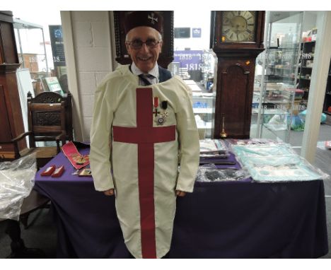 A large collection of Masonic Regalia including a full tunic with Knights Templar jewels, Craft Master aprons, Knights Templa