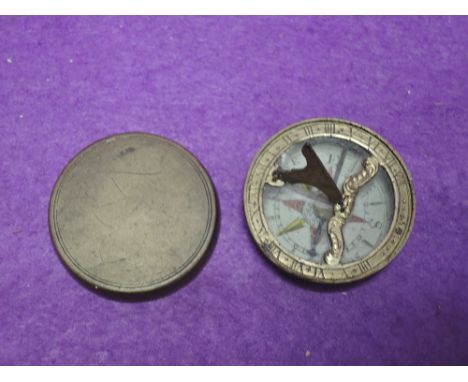 A brass engine turned 1 1/2 in diameter combination compass and sundial early 20th century, possibly military