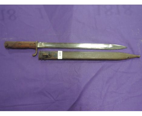 A bayonet with scabbard possibly German, damage to scabbard may be bullet hole, 124 RE 319 on quillon