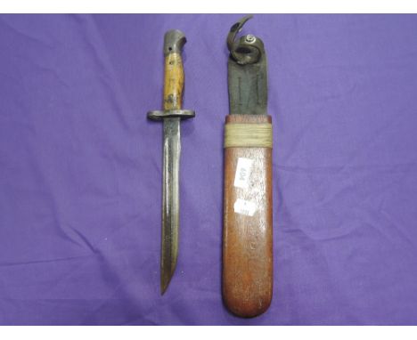 A World War I style fighting knife, cut down in size from a British SMLE bayonet, pattern 1907, with a wood and leather scabb