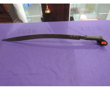 An Indian (Talwar) style sword with a decoratively carved and inlaid handle, engraved and inlaid blade, no scabbard, in poor 