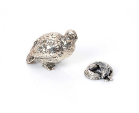 Contemporary silver small model of a grouse (London 1974), together with another small, white metal model of a curled up slee