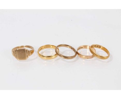 Two 22ct gold wedding rings, 18ct gold wedding ring, 9ct gold wedding ring and a 9ct gold signet ring (5)The two 22ct gold we