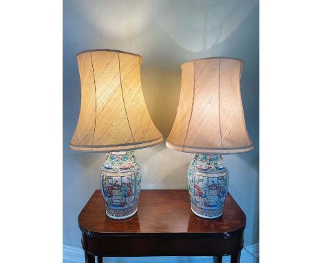 Pair of 19th century Chinese Canton enamel baluster vases, converted to lamps, moulded with dragons and painted with figural 