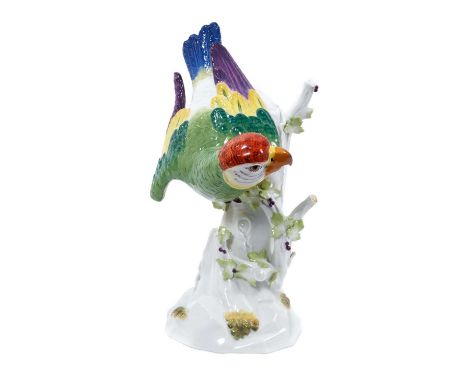 Meissen porcelain figure of a parrot, after Kändler, modelled perched on a branch, polychrome painted, incised model number 7
