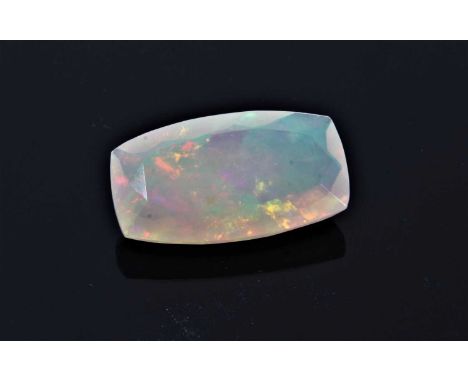 Unmounted natural opal weighing 4.56cts, the rectangular cushion shape fancy-cut stone measuring 17.38 x 9.68 x 5.40mm, accom