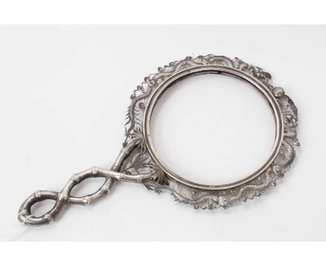 Late 19th/early 20th century Chinese white metal hand mirror frame, with dragon surround and bamboo handle (apparently unmark