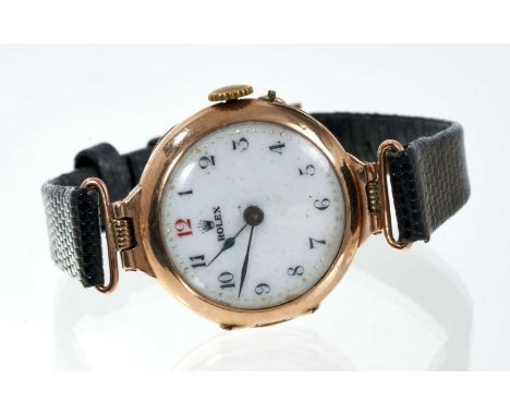 Early 20th century Rolex ladies gold wristwatch with mechanical movement, circular white enamel dial with red 12 o'clock nume