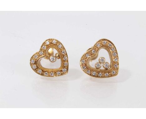 Pair of Chopard style gold and diamond set heart earrings with glazed compartments containing loose diamonds, estimated total