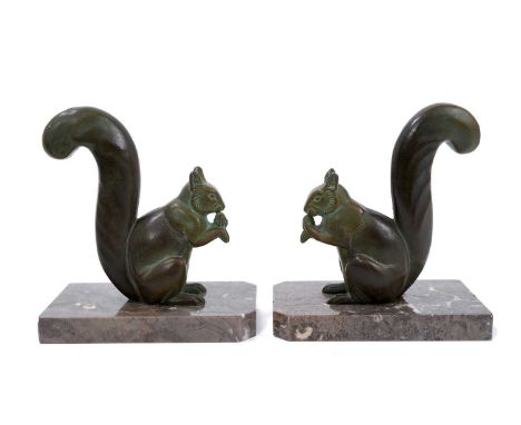 M Leducq, pair of Art Deco bronzed Squirrell bookends, signed, raised on canted marble plinths, 16cm wideSome light wear to t