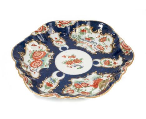 A Worcester blue scale teapot stand, circa 1770, decorated in the Kakiemon style, pseudo-Chinese mark to base, 13.5cm wideHai