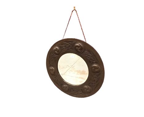 Arts and Crafts circular wall mirror in embossed copper frame, with circular bevelled plate in Celtic knot border, 62cm diame