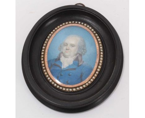 Late 18th century oval portrait miniature on ivory depicting a gentleman wearing a blue coat, within a double-sided oval gold