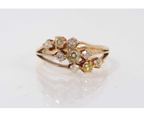 Late Victorian diamond triple crossover ring with three bands of old cut diamonds, each comprising a central fancy yellow dia