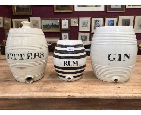 Three 19th century banded pottery spirit barrels, Gin, Rum and Bitters, the largest 33cm highProvenance: The Angela Kay Colle