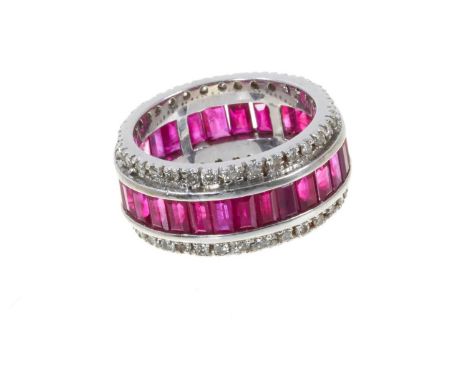 Ruby and diamond eternity ring with a full band of rectangular step cut rubies flanked by a border of brilliant cut diamonds 