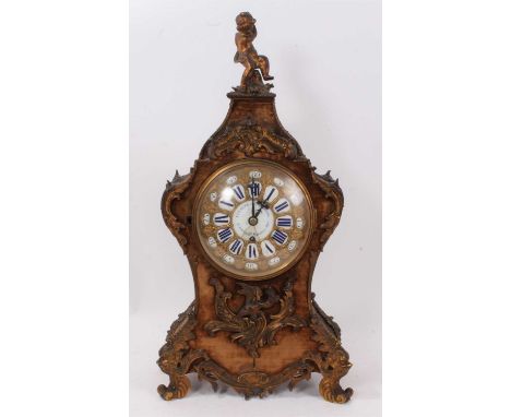 19th century French ormolu mounted cartouche shaped bracket clock, surmounted by a cherub, retailed by Cousens and Whiteside,