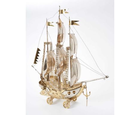 Contemporary Continental parcel gilt model of a galleon under full sale, mounted on four wheels and with a detachable upper d