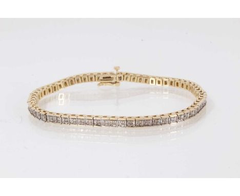 14ct gold and diamond tennis bracelet with a line of 63 brilliant cut diamonds in white gold grain setting on 14ct yellow gol