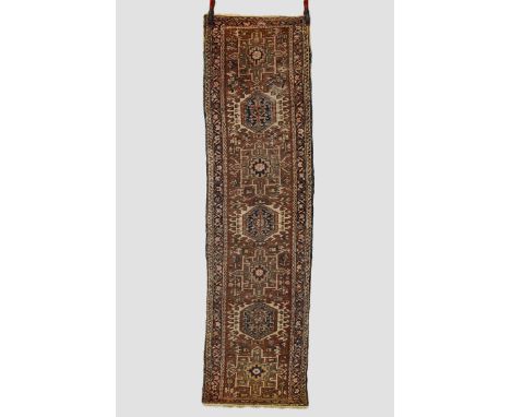Karaja runner, north west Persia, circa 1930s-40s, 8ft. 8in. X 2ft. 4in. 2.64m. X 0.71m. Overall even wear; slight loss to en