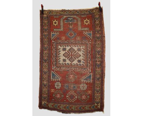 Kazak prayer rug, south west Caucasus, early 20th century, 6ft. 3in. X 3ft. 11in. 1.91m. X 1.20m. Dated 1333 (AH) [1914 AD] a