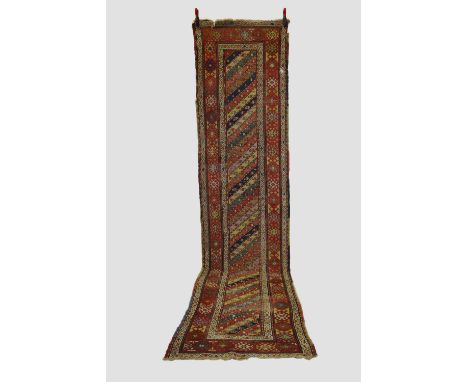 Two Gendje runners, south east Caucasus, both early 20th century, the first 13ft. X 3ft. 3.96m. X 0.91m.  Overall wear with c
