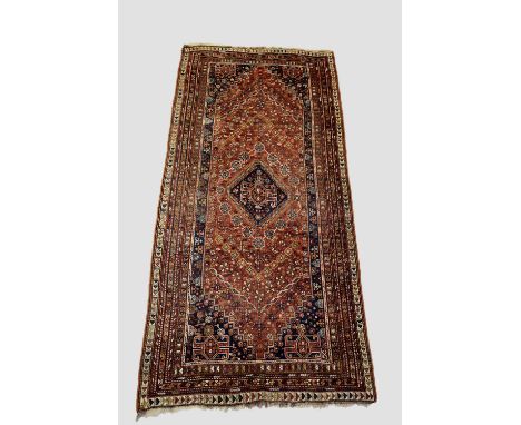 Qashqa'i long rug, Fars, south west Persia, early 20th century, 10ft. 10in. X 5ft. 1in. 3.30m. X 1.55m. Overall even wear. Ea