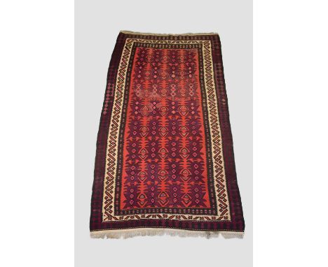 Anatolian kelim, circa 1930s-40s, 9ft. 9in. X 5ft. 3in. 2.97m. X 1.60m. Light terracotta field with all over large purple fea
