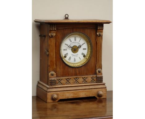 Early 20th century oak cased mantel clock, white enamel dial signed 'attorini & Sons Bradford', H32cm   Condition Report   Cl
