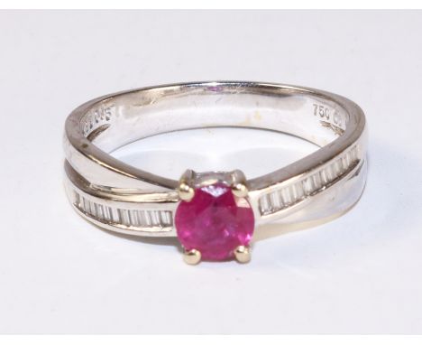 Ruby and baguette diamond white gold cross-over ring stamped 750   Condition Report   Click here for further images, conditio