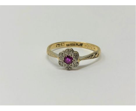 An antique 18ct gold ruby and diamond ring CONDITION REPORT: Ring size N. The shank is stamped 18ct &amp; Plat. Makers mark B