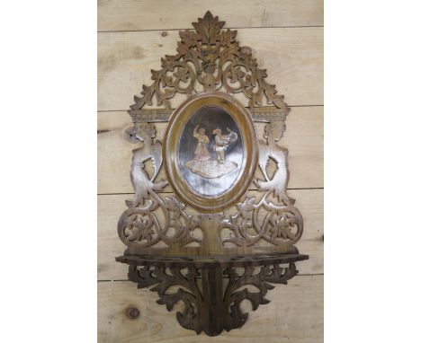 A 19th century Italian carved in Leiden pierced folding wall bracket, 18" high x 9 1/2" wide 