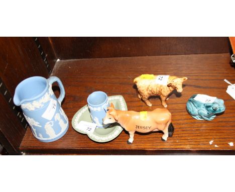 A Beswick china model of a Highland calf, two other unmarked models of a Jersey cow and frog, two Wedgwood jasperware jugs an