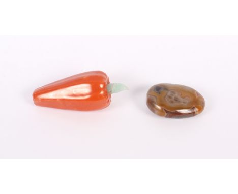A Chinese porcelain snuff bottle, in the form of a pepper, with pale celadon jade stopper, 3 1/4" long, and a polished banded