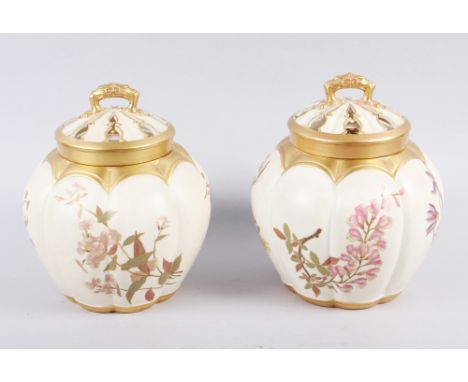 A Royal Worcester blush ivory pot pourri pot and cover and a similar companion, 7 1/2" highCondition:Damage to the outer lid 