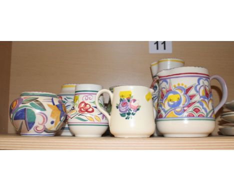 Four assorted Poole pottery jugs and four similar vases, tallest jug 9" high 