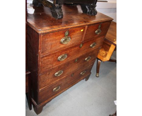 A George III oak and mahogany banded chest of two short and three long drawers with oval brass handle plates, 37" wide x 20" 