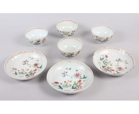 A set of four Chinese tea bowls with floral and scroll decoration, and three matching dishes (chips to rims) Condition: Chips