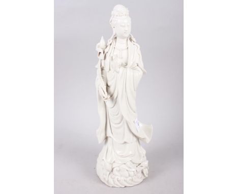 A 20th century blanc de chine figure of Kuan Yin, 11" high, three Chinese porcelain tea bowls, a turned hardstone tea bowl, a