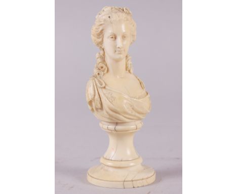 A 19th century carved ivory portrait bust of Marie Antoinette, on turned column, 4 3/4" high (age cracks) Condition: Cracks c