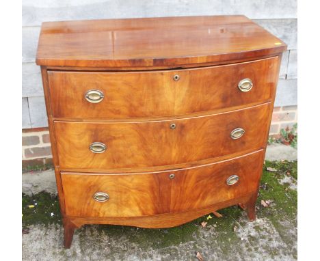A late Victorian mahogany bowfront chest of three long drawers with oval handle plates, 36" wide x 19 1/2" deep x 35" high 