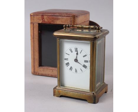A French brass and glass cased carriage clock with travel case, 4 1/2" high 