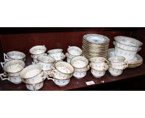 A Rockingham porcelain tea service, decorated weeping gilt foliage, comprising eleven teacups, eleven coffee cups, thirteen s