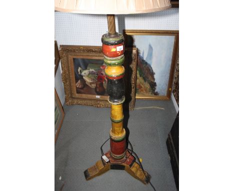 A Venetian design standard lamp with turned painted column, on triple supports 